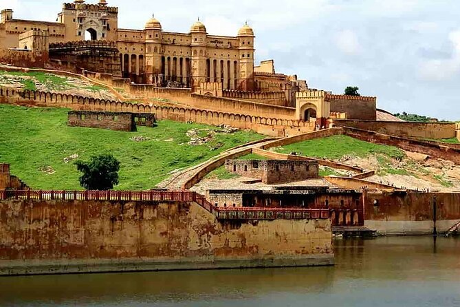 Full Day Sightseeing Jaipur Tour by Car With Guide Include Lunch - Jal Mahal Over Man Sagar Lake: Quick Views, Great Contrast